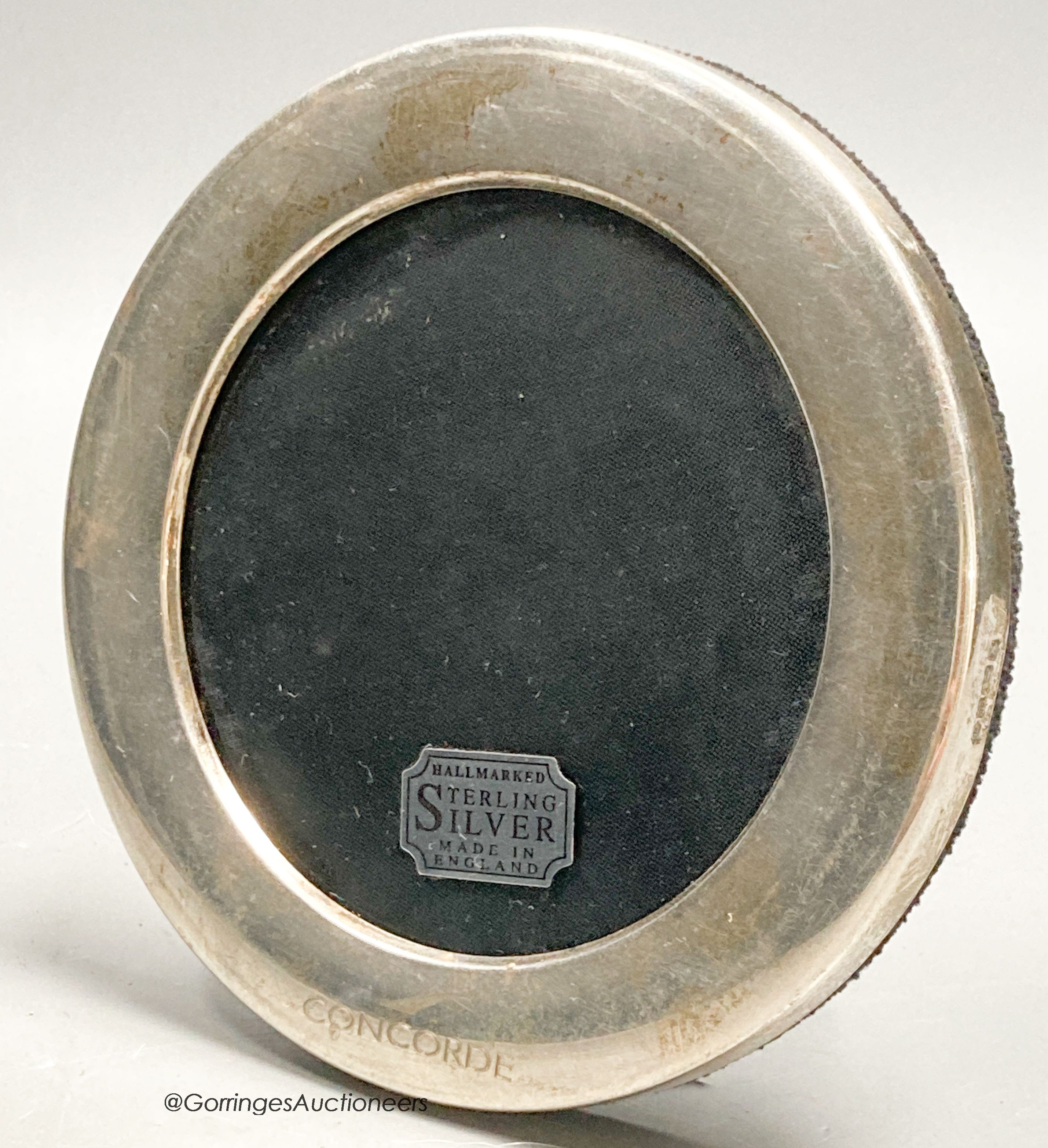 A modern silver mounted circular photograph frame, engraved 'Concorde', Carr's of Sheffield, Sheffield, 1997, diameter 11.6cm.